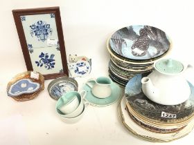 A collection of porcelain items including Poole cu