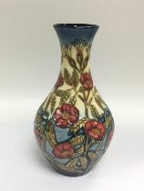 A Moorcroft vase decorated with cornflowers, appro