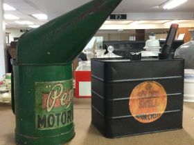 A Pem 1/2 gallon oil can and a motorcycle can