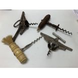 Four antique corkscrews, two concertina and the ot