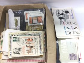 An interesting collection of foreign first day covers and unused stamps. Shipping category B.