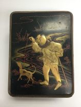 An Oriental lacquered box decorated with the figur