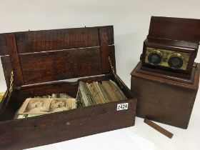 A late Victorian lacquered brass and Mahogany three D viewer with outer box and a large quantity