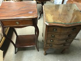 A small collection of wooden furniture including o