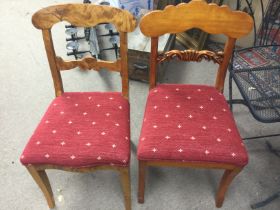 A pair of restored dining chairs with red upholste