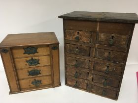 Two sewing box cabinets one with a flight of four