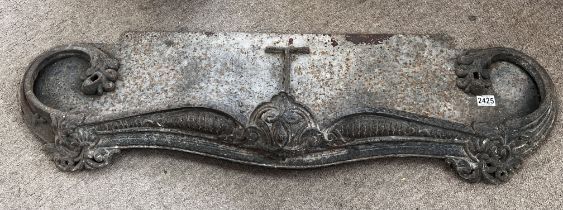 A Victorian cast iron fireplace grate section.