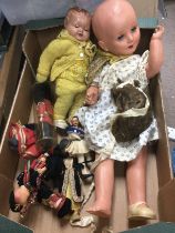 Two composition dolls and small tourist dolls. Shipping category C.