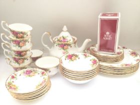 A Royal Albert Country Rose Tea And Dinner Set.