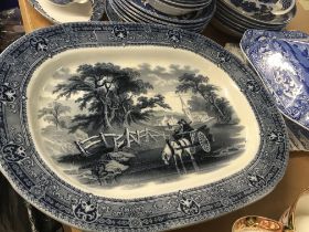 A collection of blue and white ceramics including a Victorian meat plate the centre depicting a