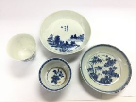 Four items of blue and white comprising two tea bo