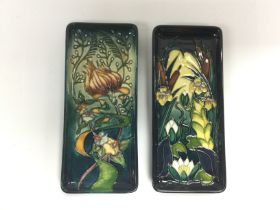 Two Moorcroft pen trays with floral decoration on