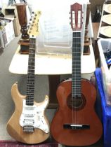 A Stagg classical guitar & a Yahama Pacifica 112 e