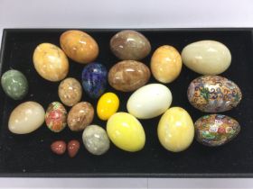 A clutch of ornamental eggs including marble and millefiori examples. Shipping category D.