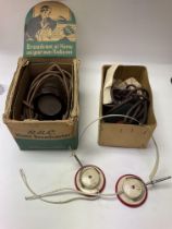Two boxed microphones and a set of Bakelite omega
