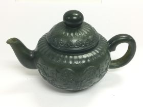 A spinach green jade teapot, approx height 8.5cm.