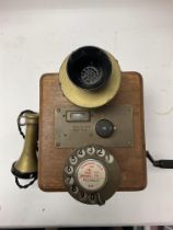 An antique wall phone.