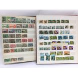 Two albums containing postage stamps of Rhodesia, Northern and Southern Rhodesia and Nyasaland.