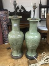 A pair of Chinese crackle glazed celadon vases converted to lamps, close match pair 49cm/51cm. (1