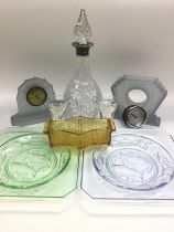 A mixed lot of glassware comprising two Bagley frosted glass clocks, two 1930s pressed glass plates,