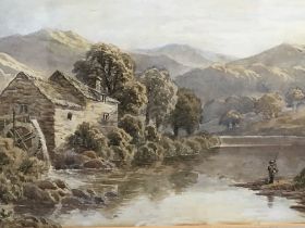 A framed 19th century watercolour study of a river with watermill and mountains beyond signed R Mann