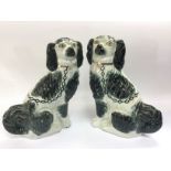 A pair of Staffordshire black and white dog ornaments, approx 30cm. Shipping category D.