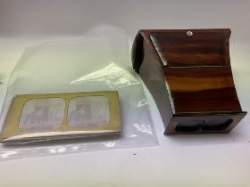 A Brewster type stereoscope with stereo cards.