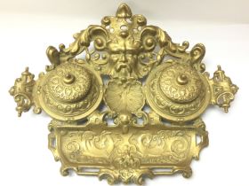 A Victorian brass desk piece. Postage category C
