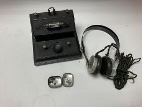 A brownie Bakelite crystal set with headphones and