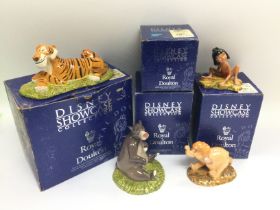 Four boxed Royal Doulton Disney Showcase figures.