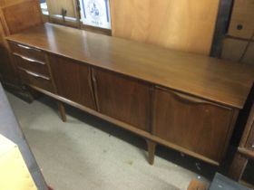 A G Plan style sideboard fitted with three drawers, double door cabinet and drinks cabinet