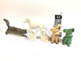 A collection of ceramics figures including dogs etc