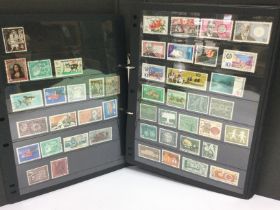 Eight albums of world postage stamps including Germany, Great Britain, Italy, India and