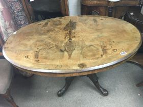 A Victorian oval Lou table on turned support shape