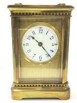 A brass cased carriage clock, 6x8x11.5cm Postage c