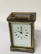 A brass cased carriage clock maker Mappin & Webb. Seen working with key.