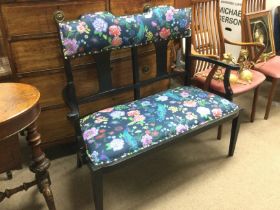 An Edwardian floral upholstered sofa. Shipping cat