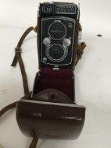 A leather cased Vintage Camera A Yashica Mat LM.