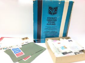 Stanley Gibbons stamp album and a collection of lo