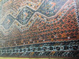 A modern cotton kork wool rug made in Shiraz, Iran. Approx 9'9x6'11. Shipping category D.