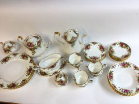 A royal Albert country roast tea sea. Damage to the lid of the coffee pot. Postage D