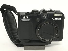 A Canon Powershot G11 camera, postage category B-