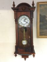 An 8 day mahogany cased wall clock.