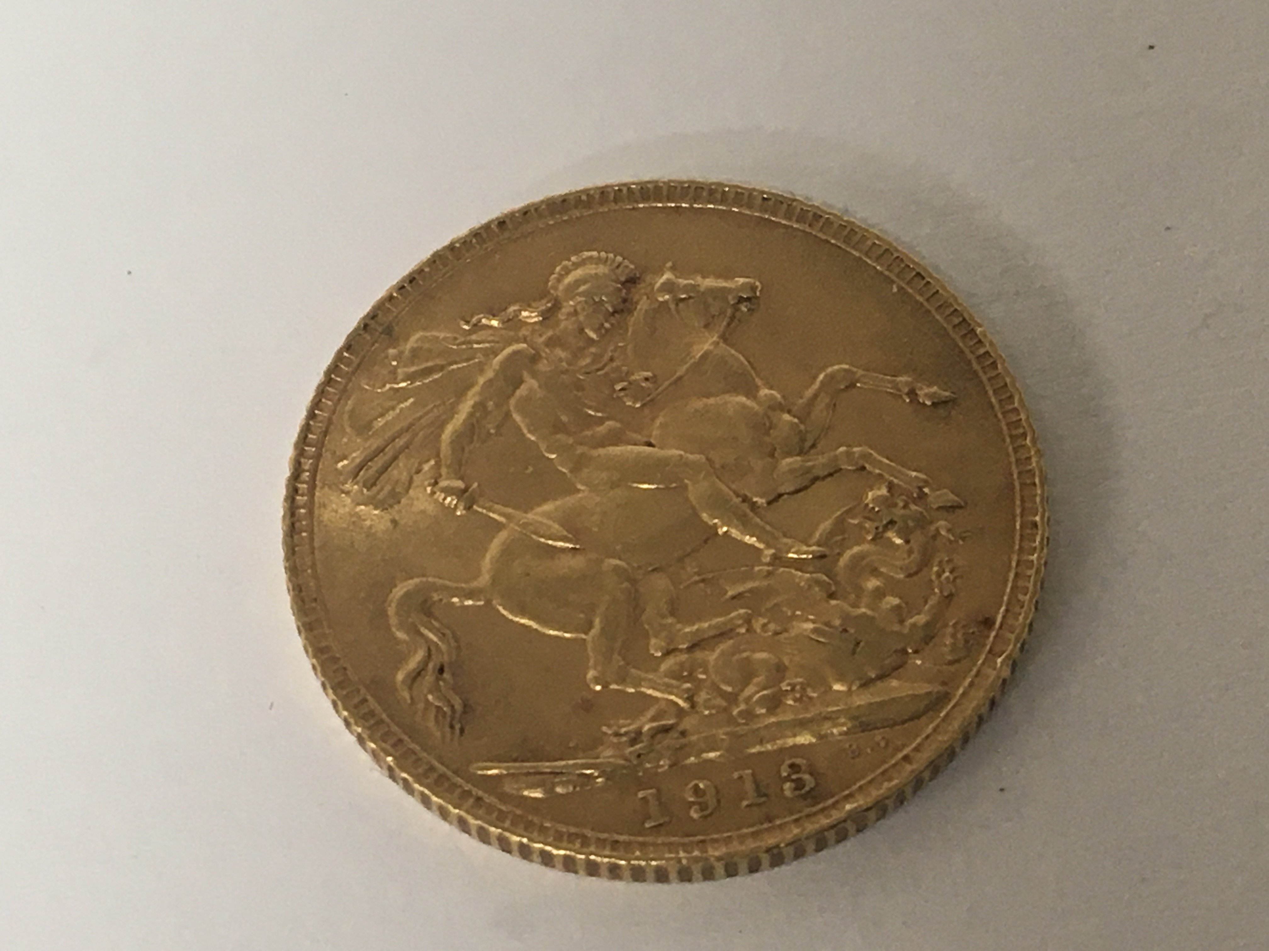 A 1913 George V Gold Sovereign.