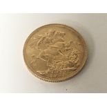 A 1911 George V Gold Sovereign.