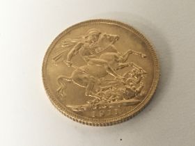 A 1911 George V Gold Sovereign.