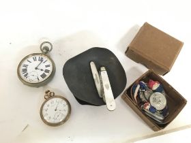A collection of items including Two pocket watches
