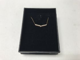 A 14ct rose gold necklace set with diamonds. Appro