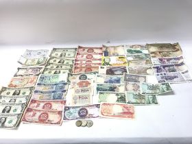 A collection of world bank notes including US doll