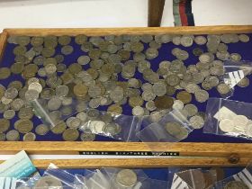 A collection of silver English six and three pennies including some George III and other world
